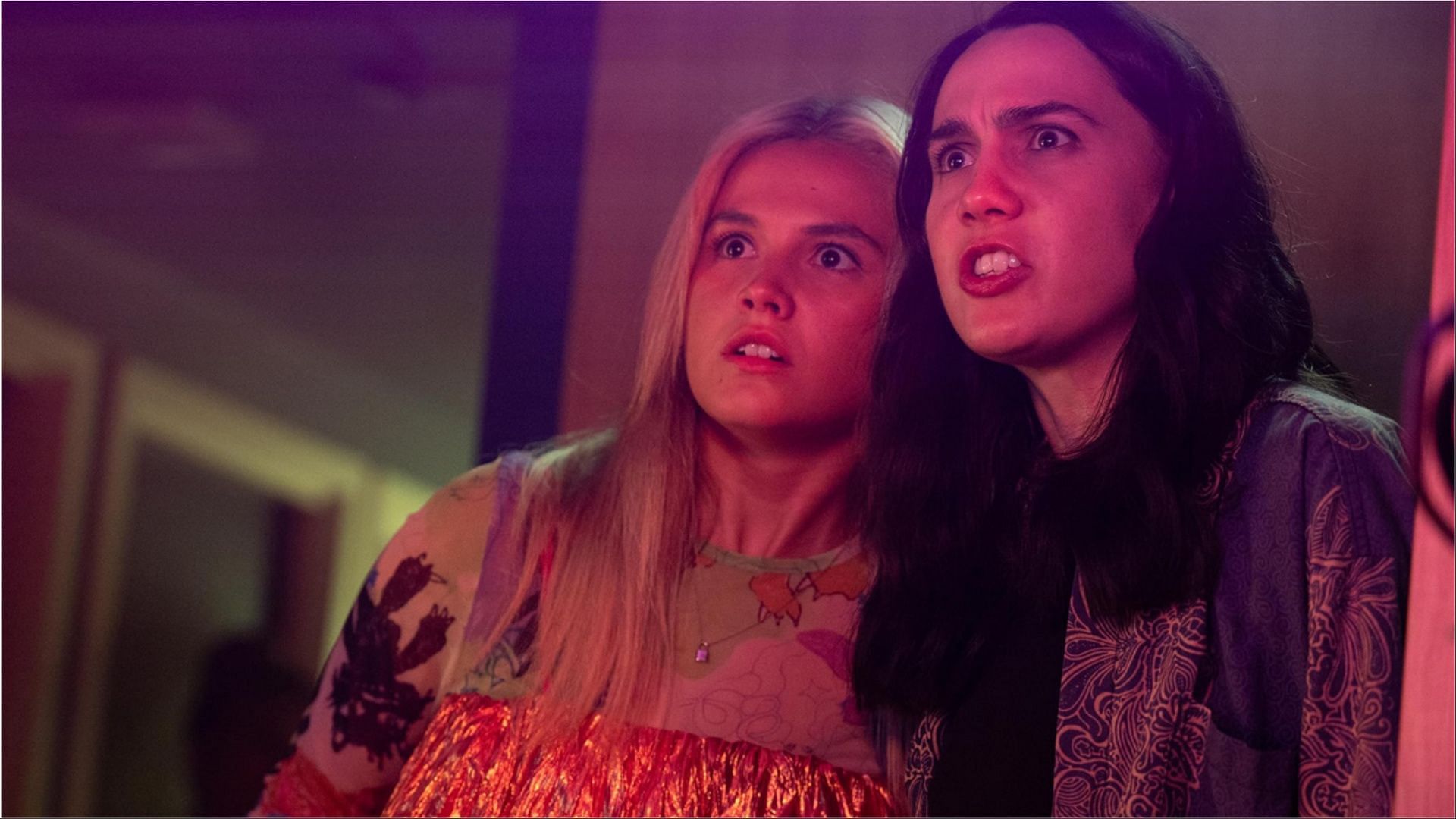 Billie and Josie react to chaos unfolding in one of the standout moments from Such Brave Girls season 2. (Image via Hulu)